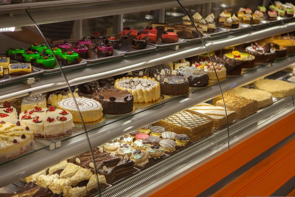 Bringing cake in the office should be seen as harmful to your colleagues in the same way as passive smoking, the chairwoman of Britain’s top food watchdog has said.