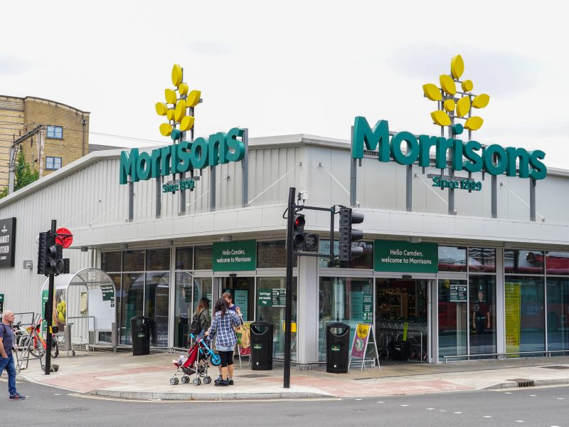 Morrisons' credit rating has been downgraded after reporting a drop in its sales and profits performance.
