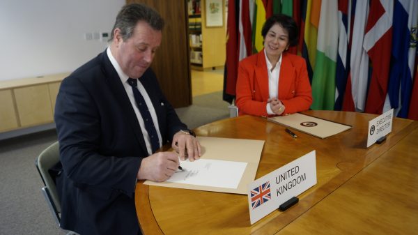 RT Hon Mark Spencer MP signing the International Coffee Agreement