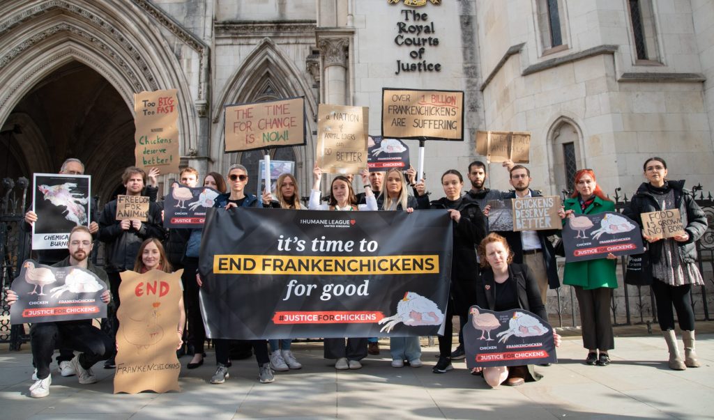 The Humane League supporters outside the court protesting use of Frankenchickens