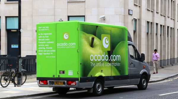 Ocado Group has revealed a new deal for Ocado Intelligent Automation (OIA), that will see it sell its warehouse technology in a sector outside of grocery retail, here showing a green branded grocery truck
