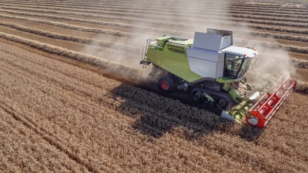 Climate crisis and rising energy prices have seen household food bills soar by over £600, with experts warning that it could increase even further, here depicting a tractor in a wheat field