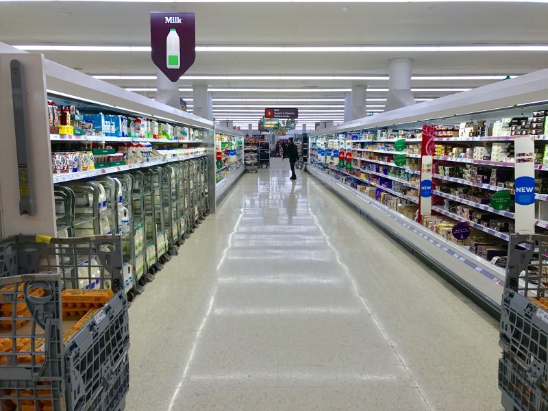 Inflation slowed by more than expected last month, driven by the prices of grocery staples such as pasta, milk and butter, depicting a UK supermarket aisle here