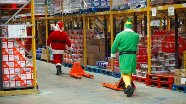 Poundland has taken to the roads with three Santa trucks delivering festive goodies to its stores, as part of its Christmas campaign, here depicting Santa and Elves in distribution store