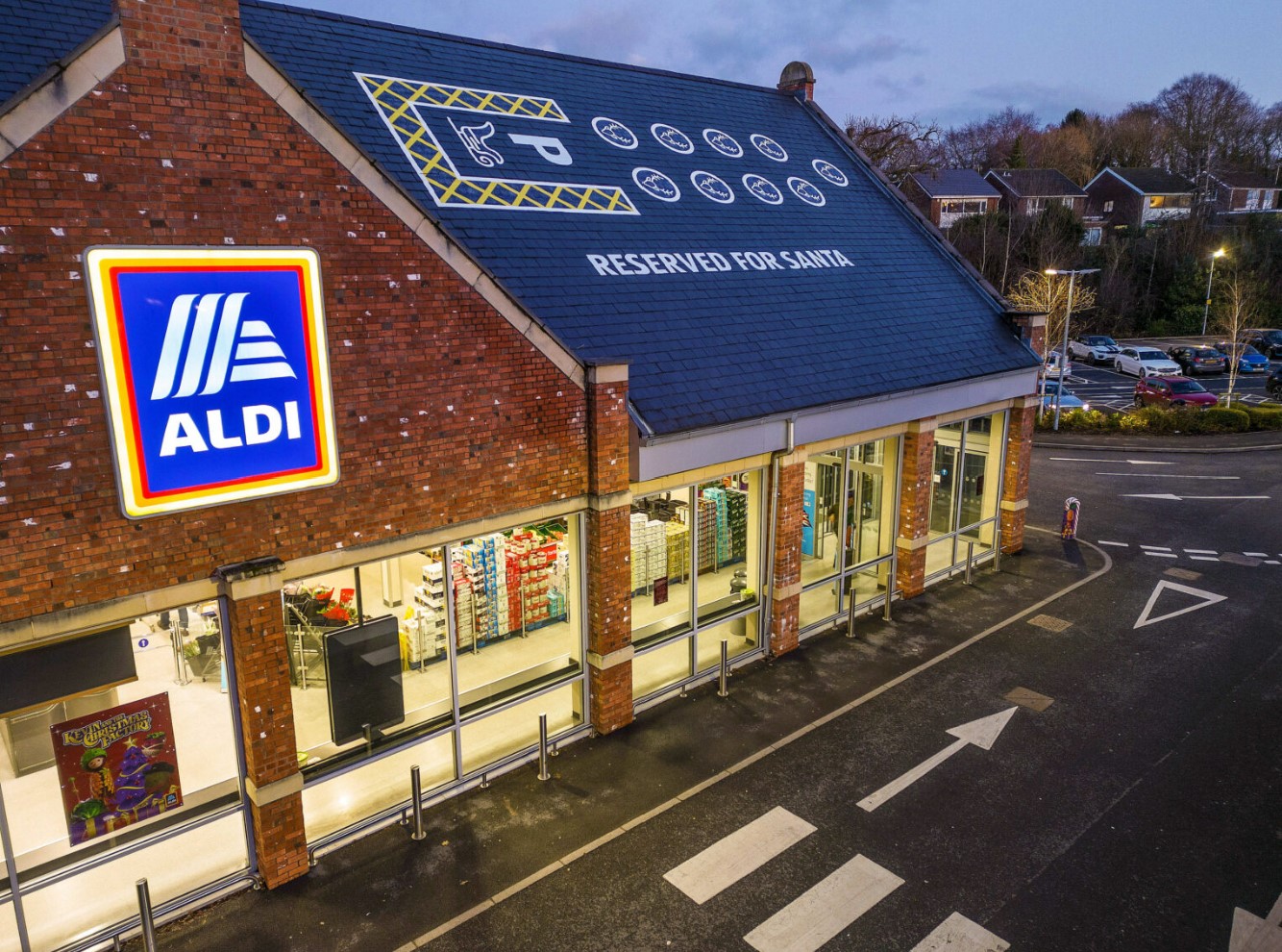 Aldi has saved a giant rooftop parking spot for Santa and his reindeers on top of one of its stores, here depicting the Aldi store