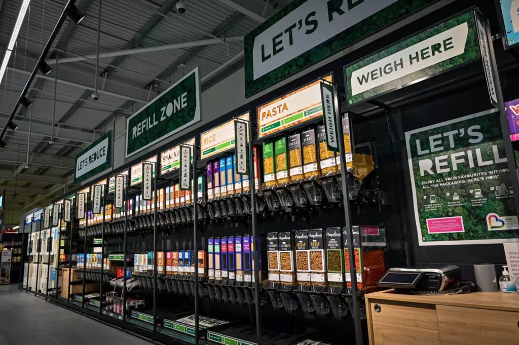 Asda has released a 'positive' first external ESG rating showing that the supermarket giant is "already in line with the largest retailers in [its] sector", here depicting an Asda sustainability refill scheme