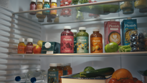 Here depicting Britvic owned Plenish's holistic range of juices in a fridge with a selection of other Plenish products