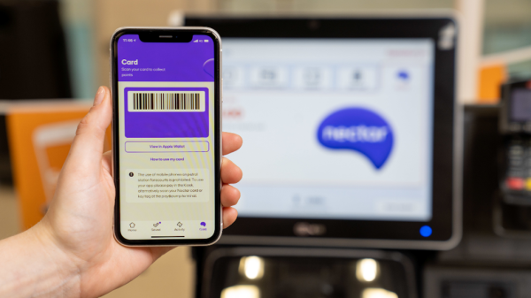 Sainsbury's has released its annual Nectar card shopping round-up 'Check you out', revealing its shoppers personalised top purchases of 2023, here depicting a Nectar card app and a Sainsbury's till