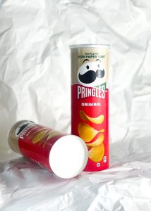 Pringles has debuted home-recyclable paper tubes through a new exclusive partnership with Tesco, depicted here