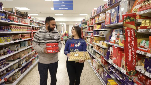 Tesco has raised its profit forecast following a record festive bumper that saw its sales grow over six weeks to Christmas by 6.8%, here depicting staff in festive attire