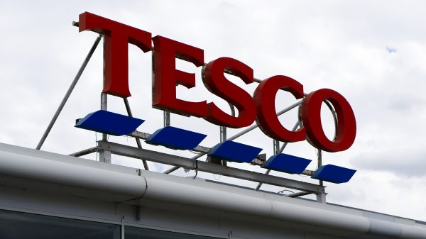 The boss of trade union Unite the Union has slammed supermarket giant Tesco's profits as the latest example of "profiteering", depicting here a Tesco sign on a cloudy day