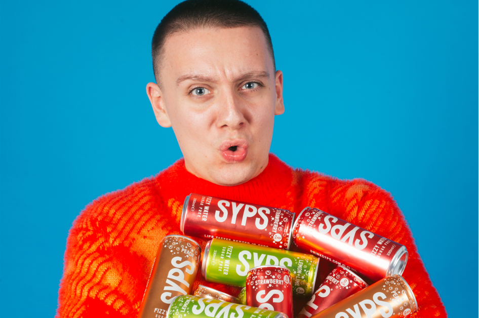 Aitch with cans of Syps -launching exclusively in Iceland