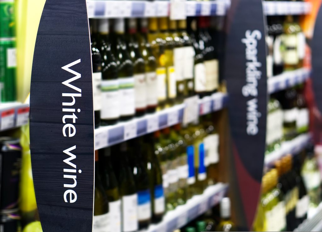 Consumers are switching to smaller higher-quality alcoholic drinks in a move linked to "moderation trends and financial factors", say experts, here depicting wine a in a supermarket