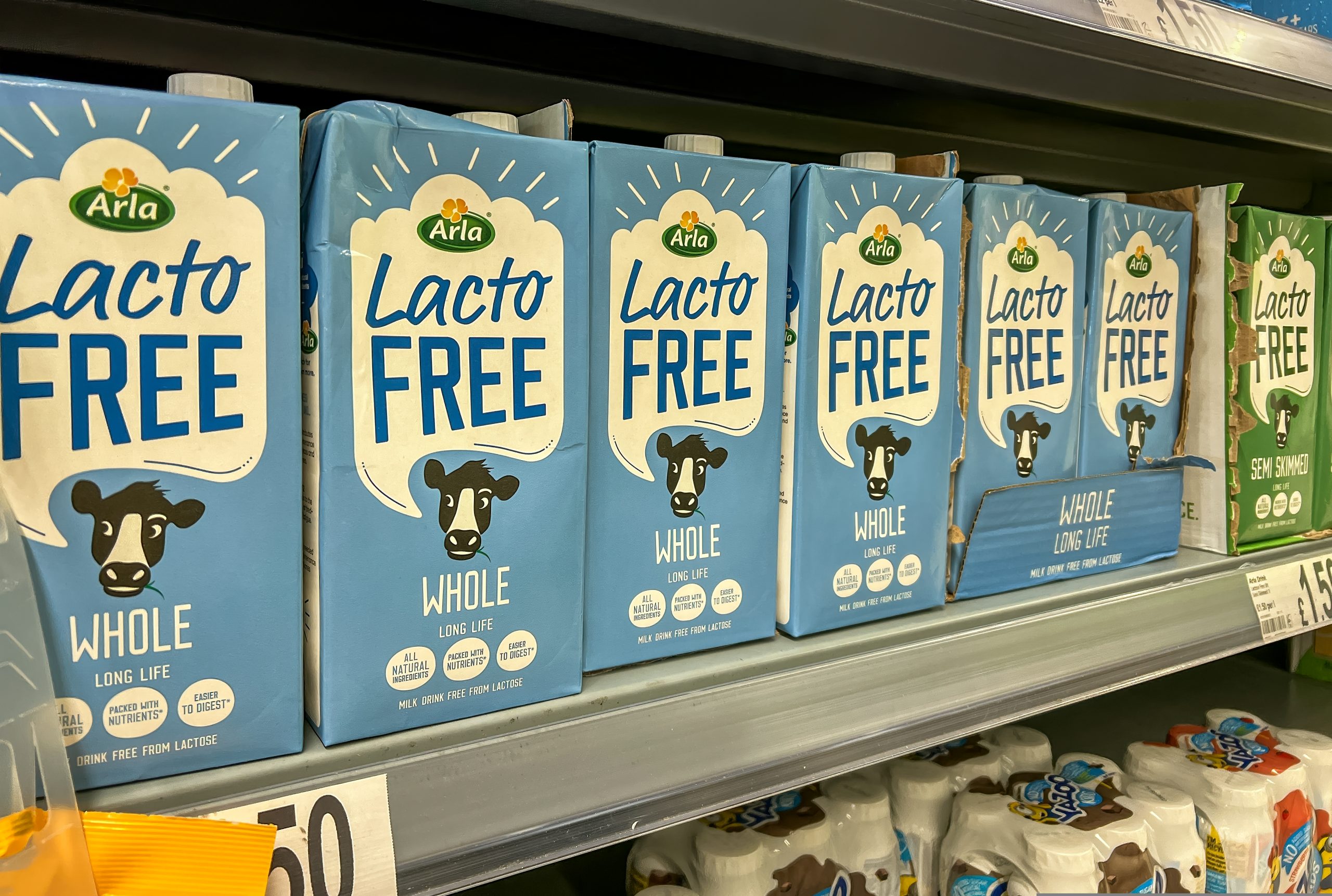 Here depicting Arla Foods Lactose Free Milk cartoons on a shelf