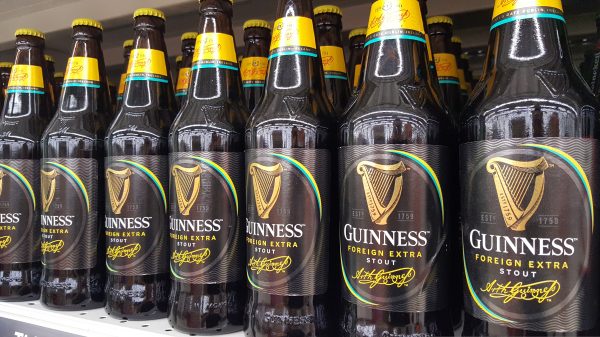 Here depicting Guinness Foreign Stout bottles on a shelf