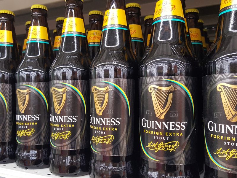Here depicting Guinness Foreign Stout bottles on a shelf