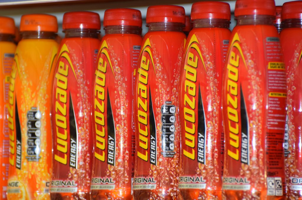 Here depicting Lucozade on a shelf