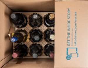 Here showing a full branded box on Naked Wines wine bottles in a bird-eye view