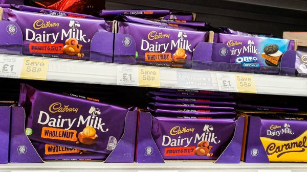 Cadbury chocolate bars on supermarket shelf - re Mondelez continues to trade in Russia