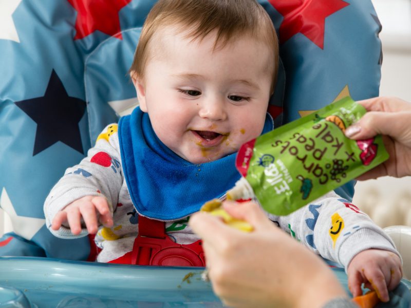 Here depicting a baby eating Ella's Kitchen