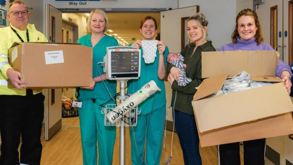 Tesco is to donate 23,000 packs of own-brand premature baby clothes to neonatal wards in hospitals across the UK, here showing NHS staff, parents and Tesco employees with premature baby clothes