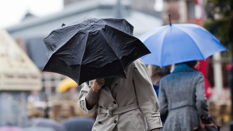 Shutterstock – People,Walking,With,Umbrellas,In,The,Rainy,City