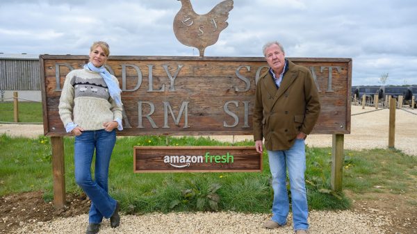 Supplied - Diddly Squat Amazon Fresh Farm depicting Jeremy Clark and colleague with sign