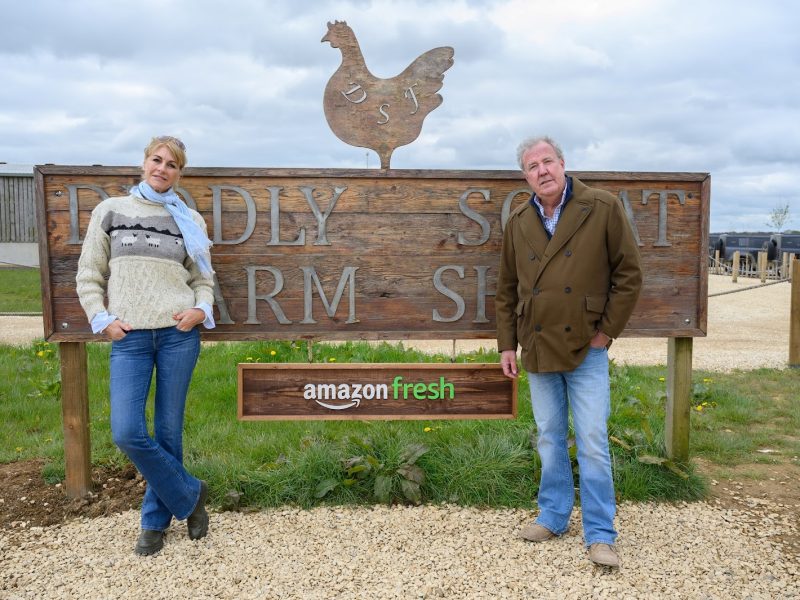 Supplied - Diddly Squat Amazon Fresh Farm depicting Jeremy Clark and colleague with sign