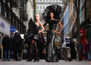 *** FREE FOR EDITORIAL USE ***<br /> Models [Shanelle &amp; Jacquelin] wear a haute-couture collection of Aldi’s recycled plastic bin bags [outside London Fashion Week/ at their Old Street store], a collaboration challenging expensive high-fashion between the supermarket chain and designer Ethan Leyland. Aldi’s ‘Trash-Formations’ fashion looks were created over 270 hours, using over 100 Aldi bin bags, costing just £1.25 a roll. It follows Aldi’s 2024 satirical campaign of Italian luxury brand Moschino’s ‘celery’ bag. Photo credit should read: Joe Pepler/ Pinpep.