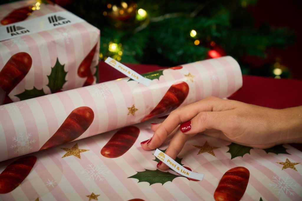 Budget supermarket chain Aldi has launched a 'lickable' pigs in blankets wrapping paper.