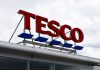 The boss of trade union Unite the Union has slammed supermarket giant Tesco's profits as the latest example of "profiteering", depicting here a Tesco sign on a cloudy day
